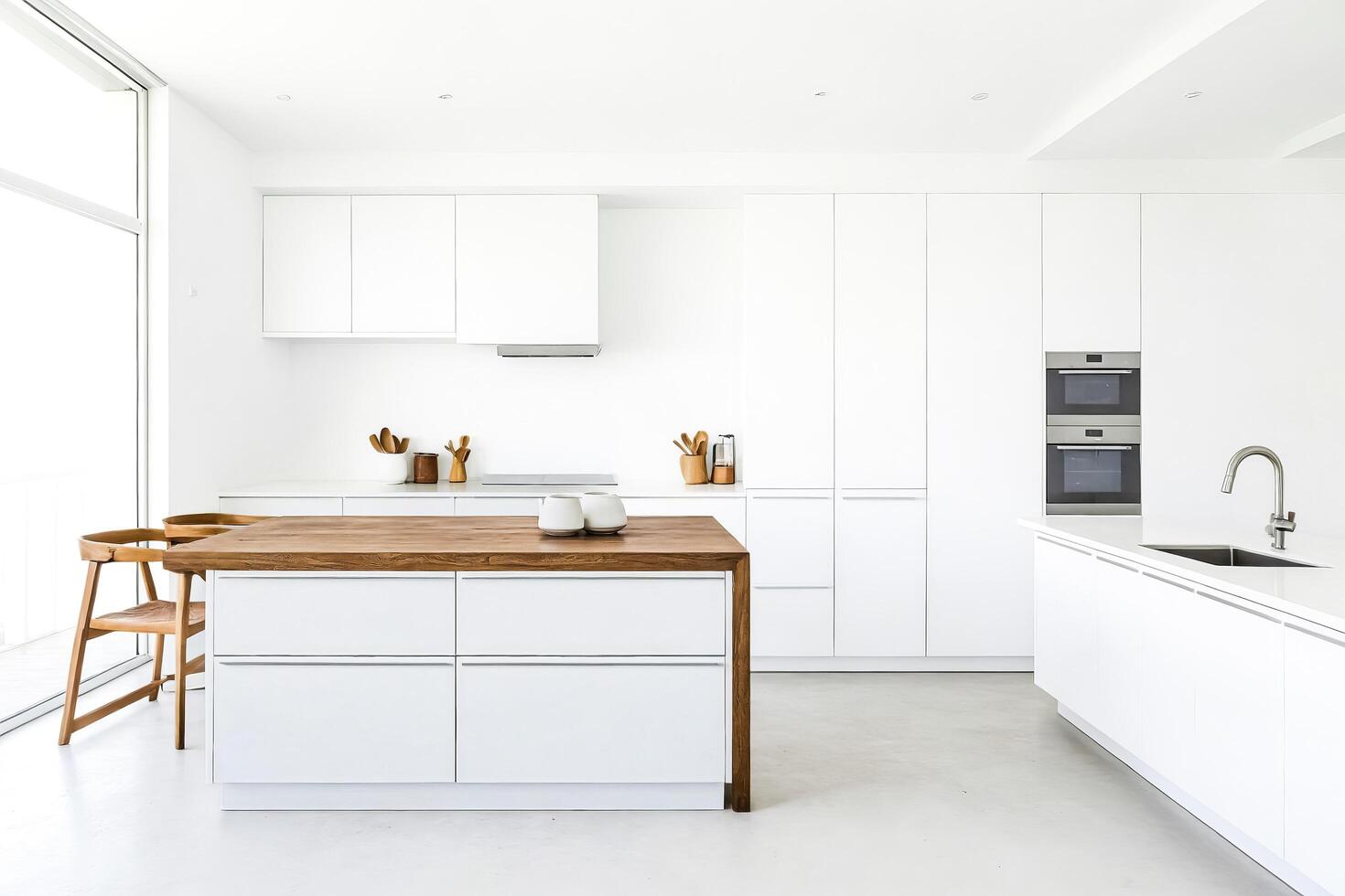 Modern White Kitchen Island with Wooden Countertop and Two Chairs photo