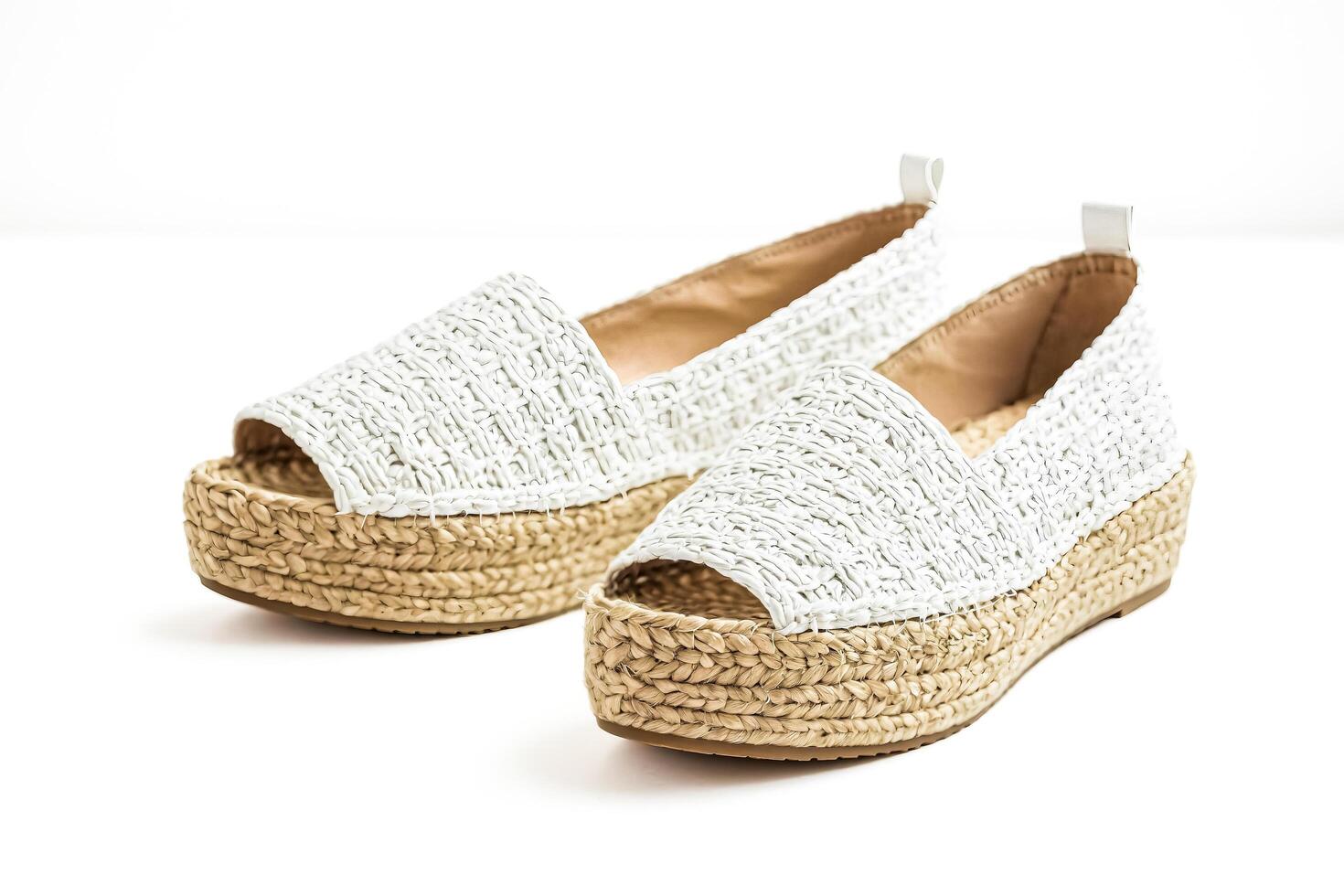 White woven espadrille sandals isolated on white background photo