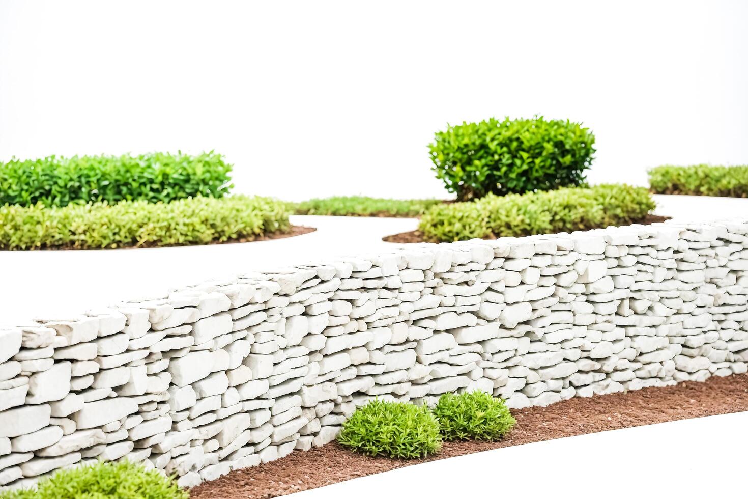 White Stone Wall With Green Plants photo