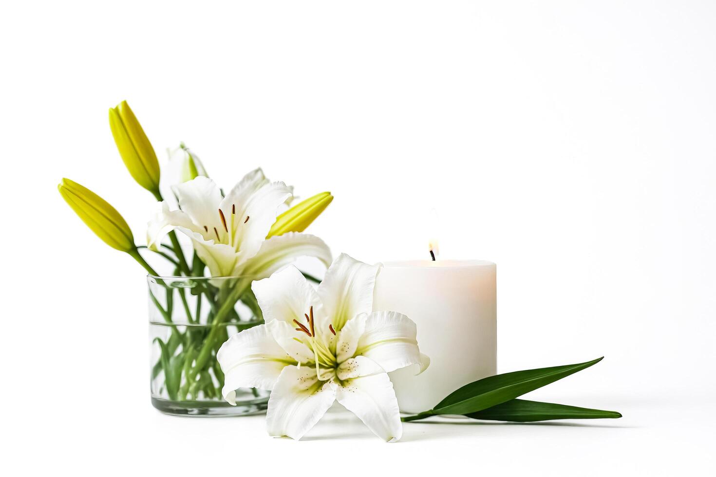 White Lily Flowers and Burning Candle on White Background photo