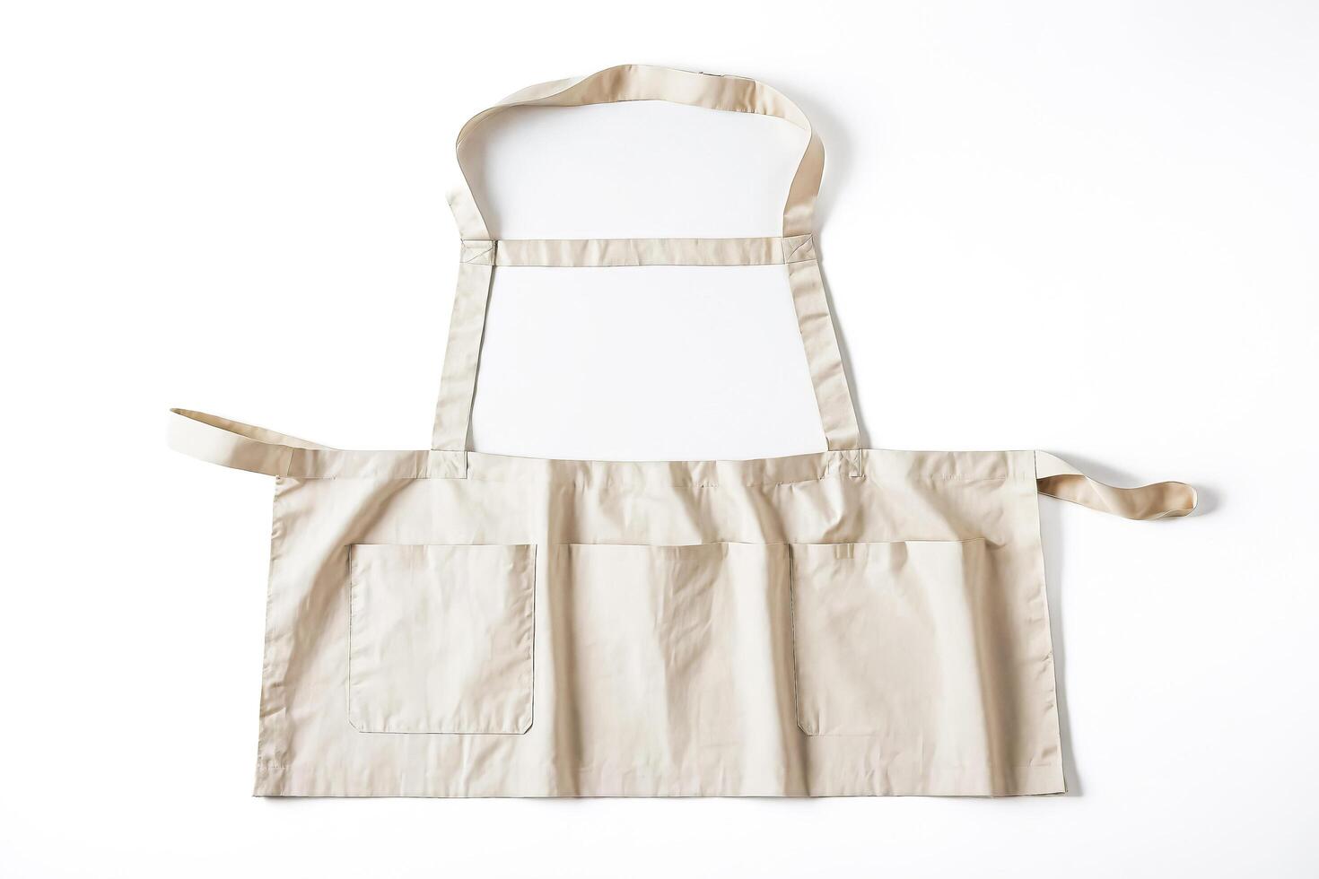 Beige Apron with Pockets Isolated on White Background photo