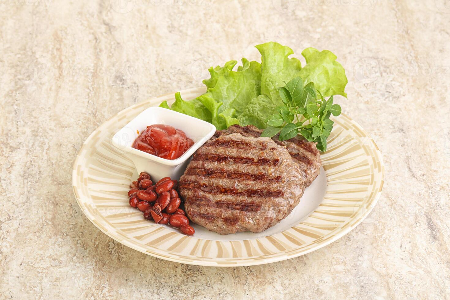 Grilled beef burger cutlet with sauce photo