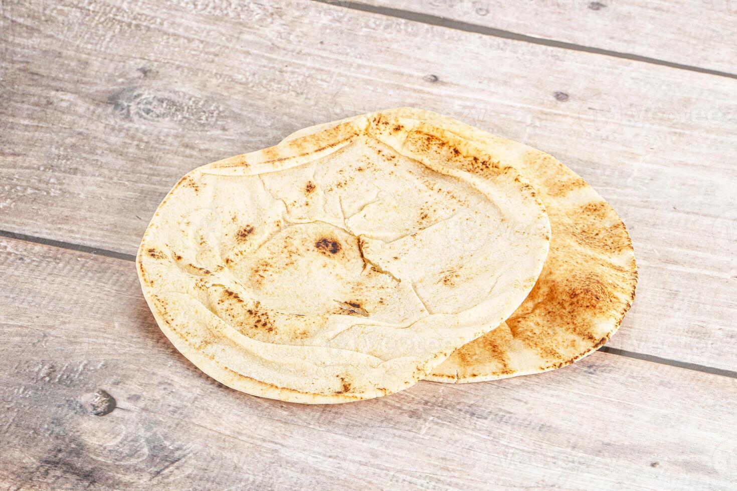 Traditional eastern round pita bread photo