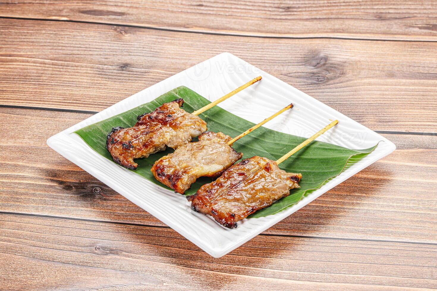 Thai cuisine - grilled pork skewer photo