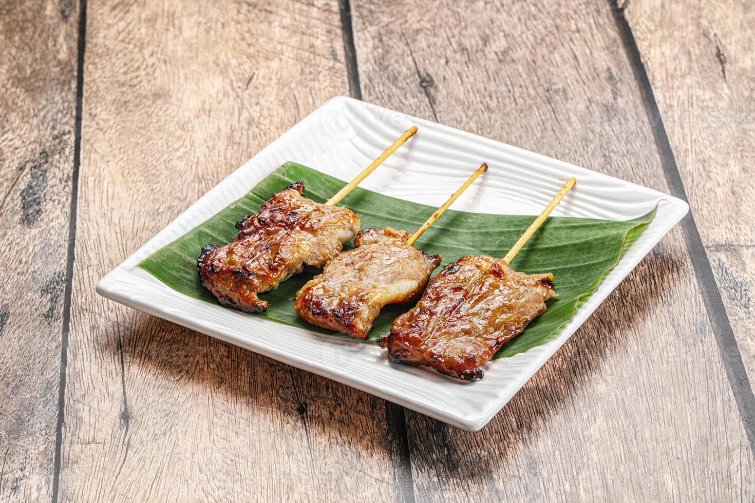 Thai cuisine - grilled pork skewer photo