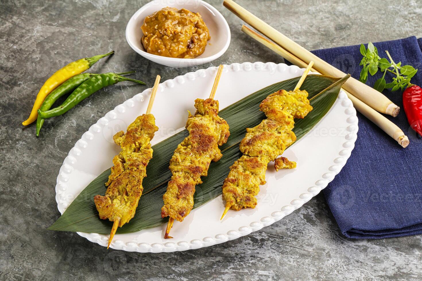 Thai meat skewer Satay with sauce photo