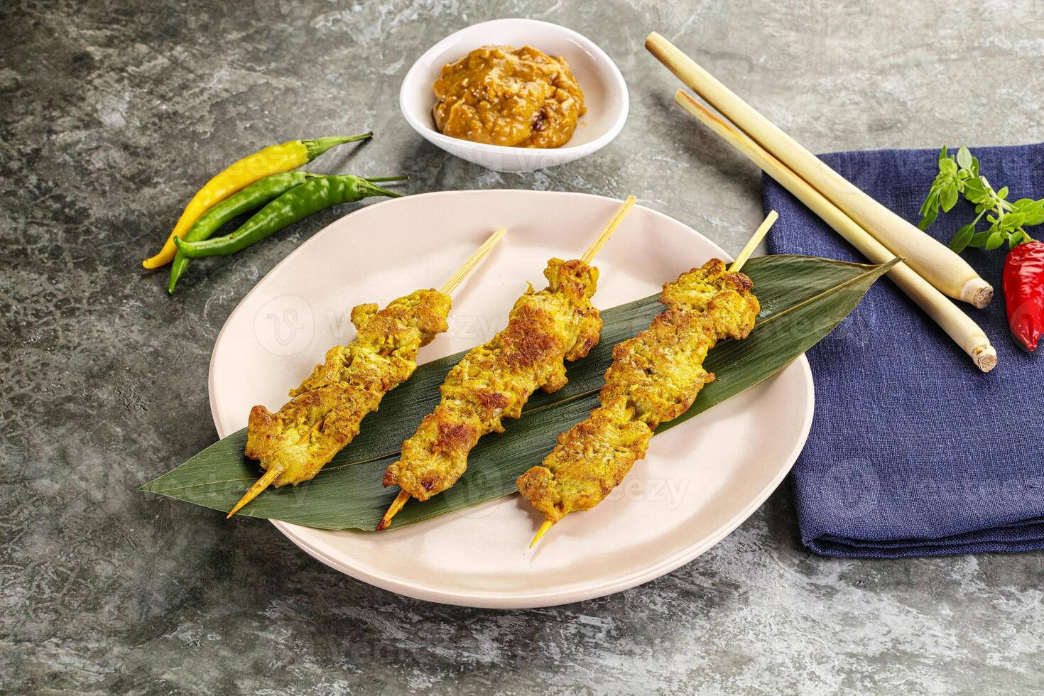 Thai meat skewer Satay with sauce photo