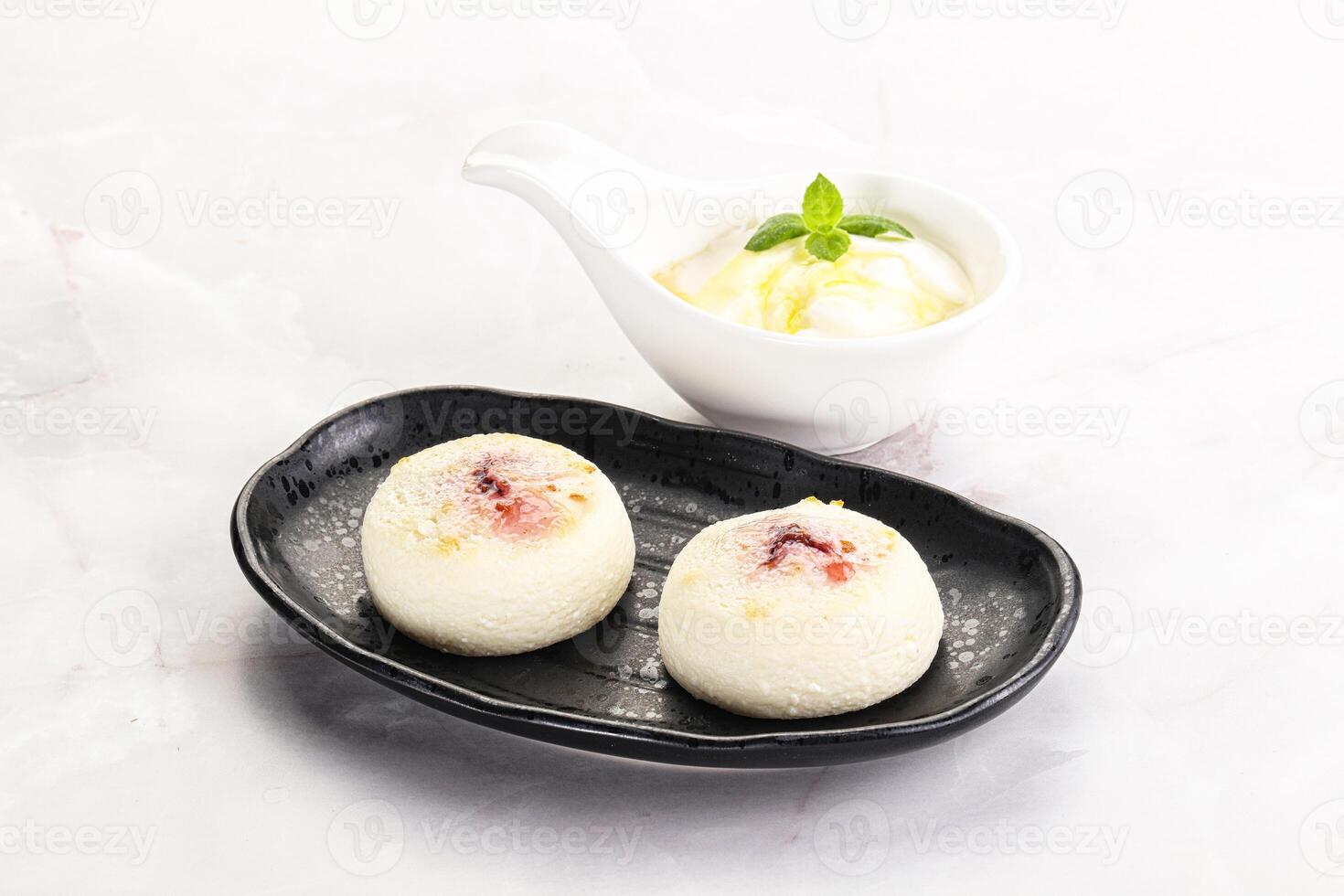 Curd pancakes with sour cream photo