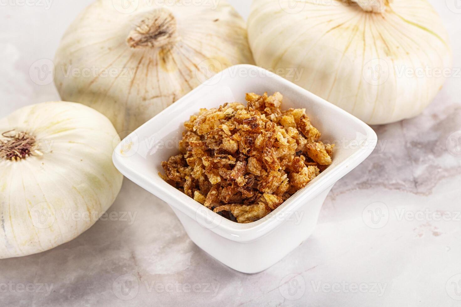 Dried roasted onion flakes for culinary photo