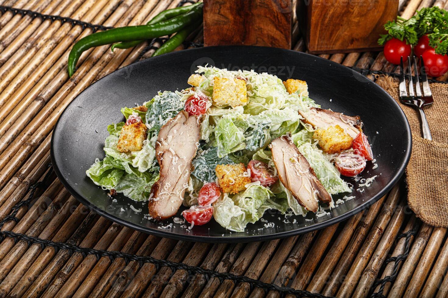 Caesar salad with chicken and romano photo