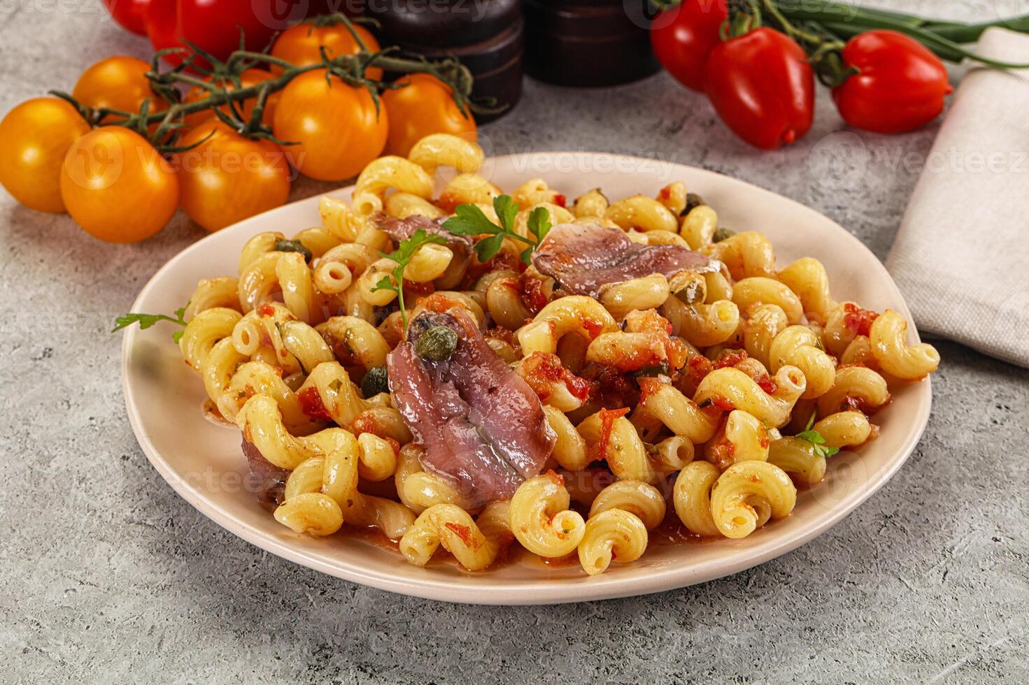 Italian pasta cellentani with anchovy photo