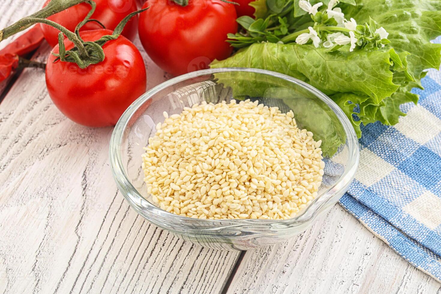 Raw sesame seeds in the bowl photo