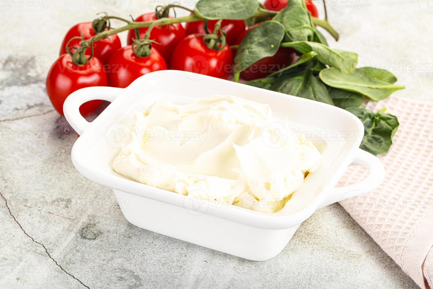 Soft cream cheese in the bowl photo