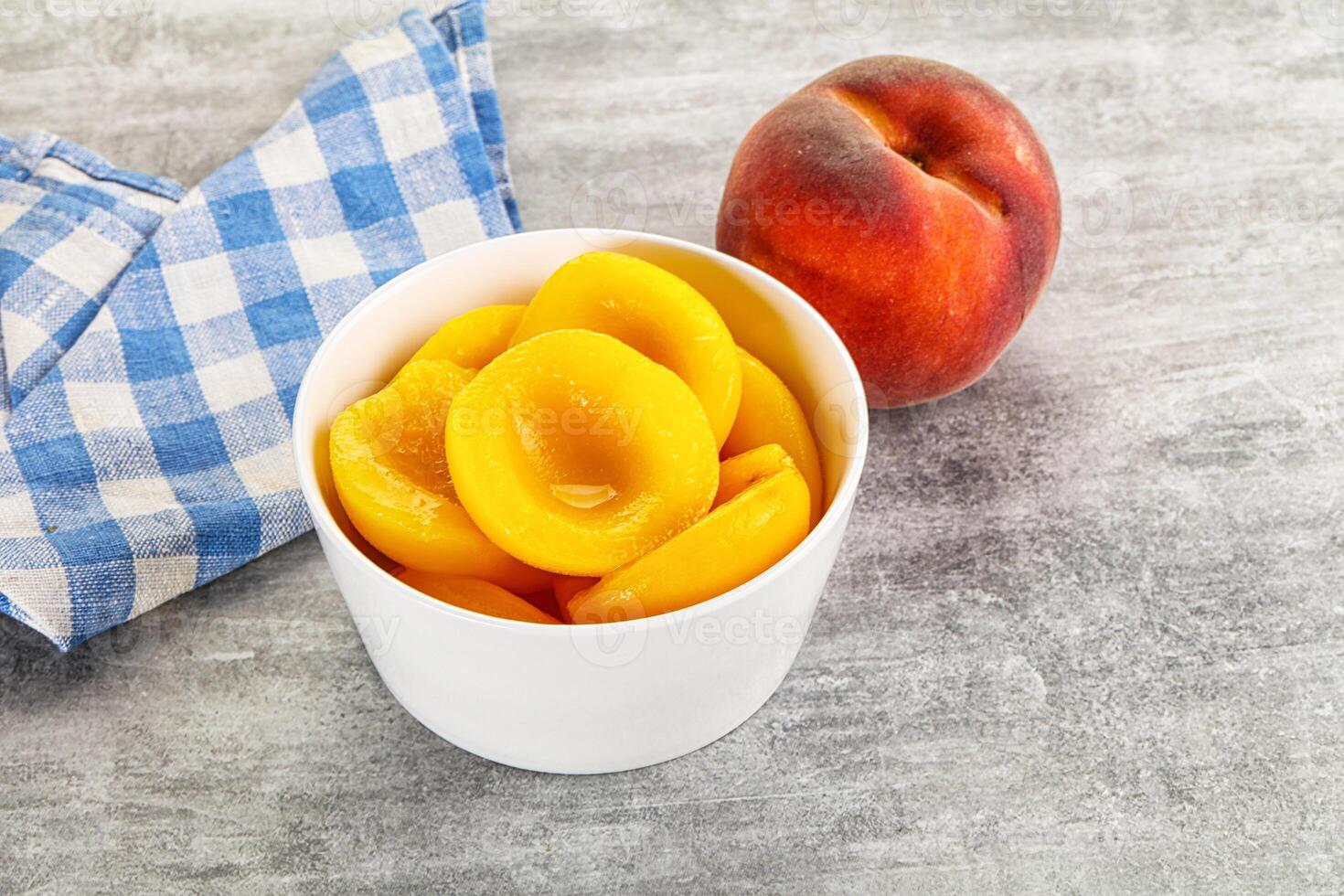 Ripe sweet and juicy canned peach photo