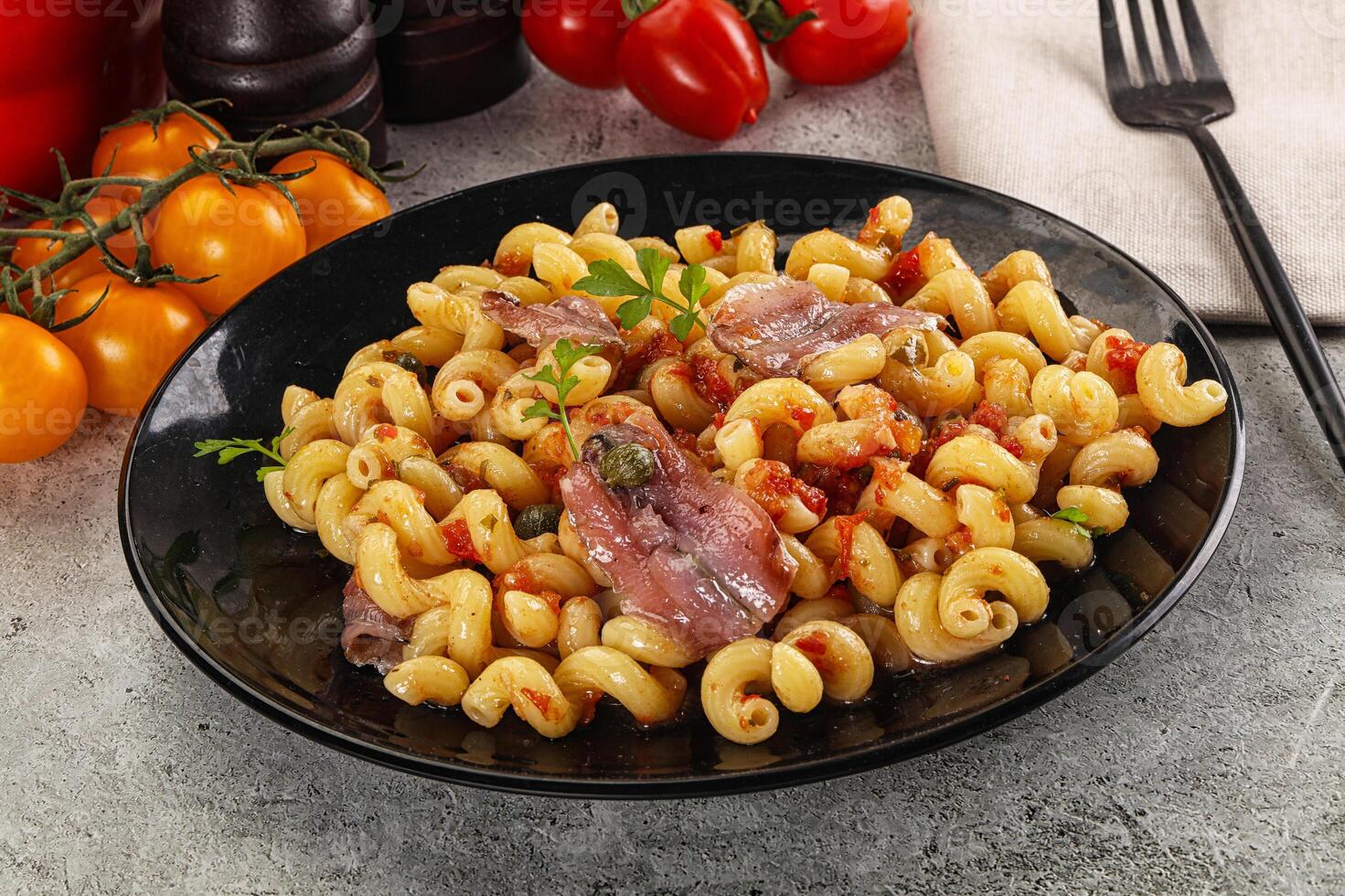 Italian pasta cellentani with anchovy photo