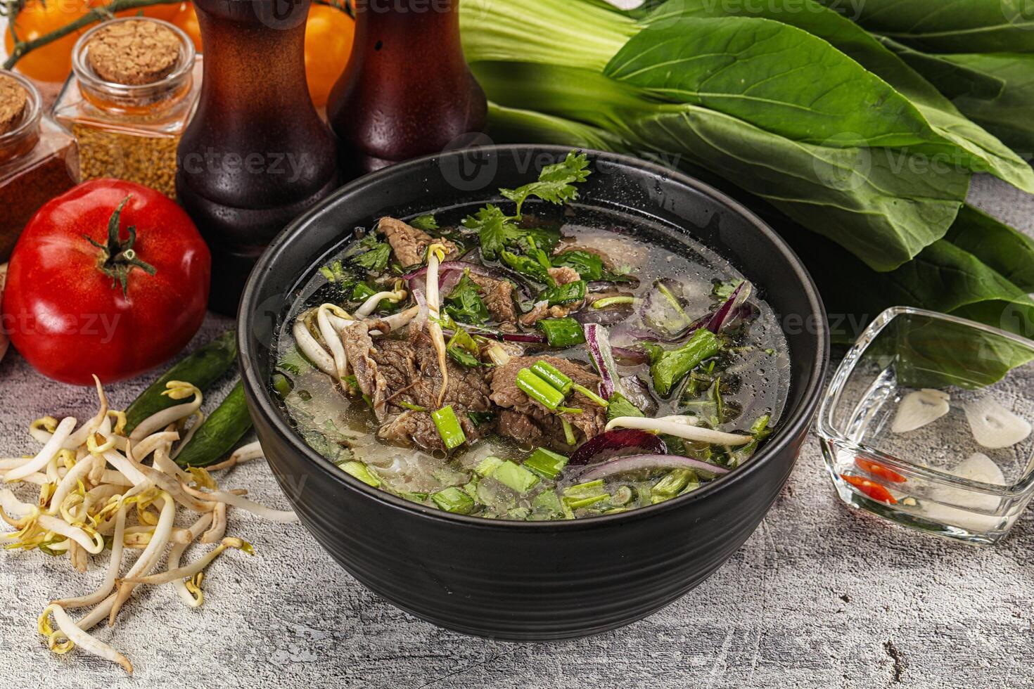 Vietnamese cuisine - Pho Bo soup with beef photo