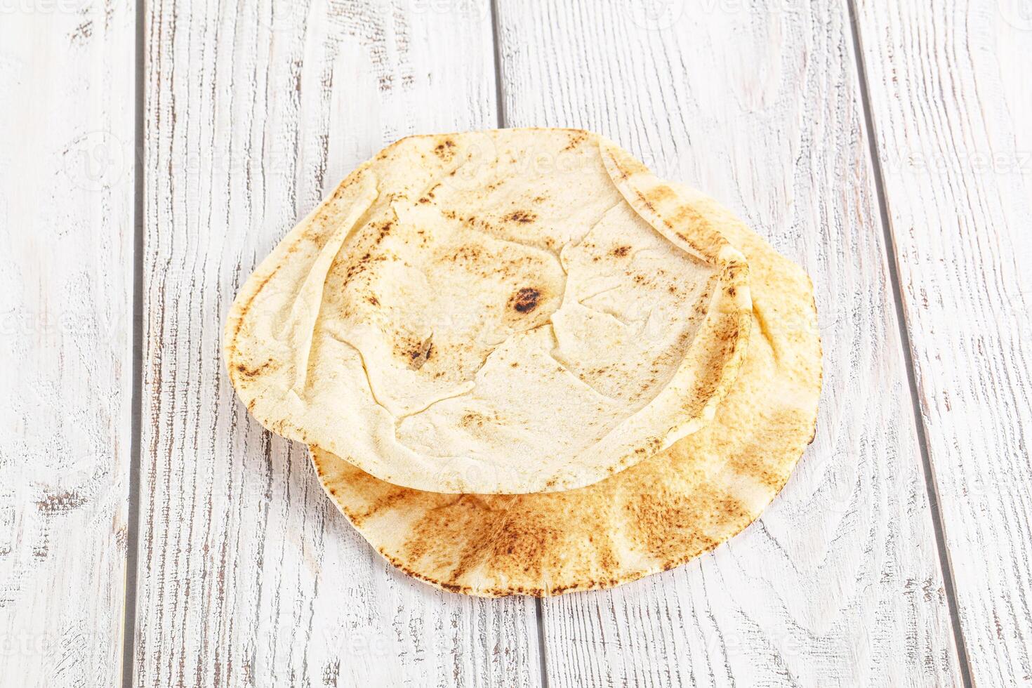 Traditional eastern round pita bread photo