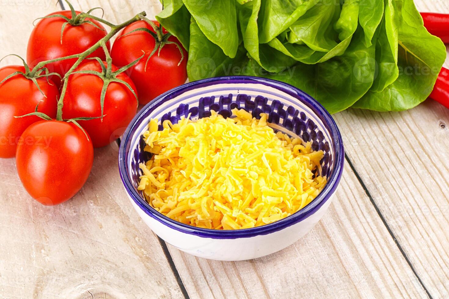 Shredded cheese in the bowl photo