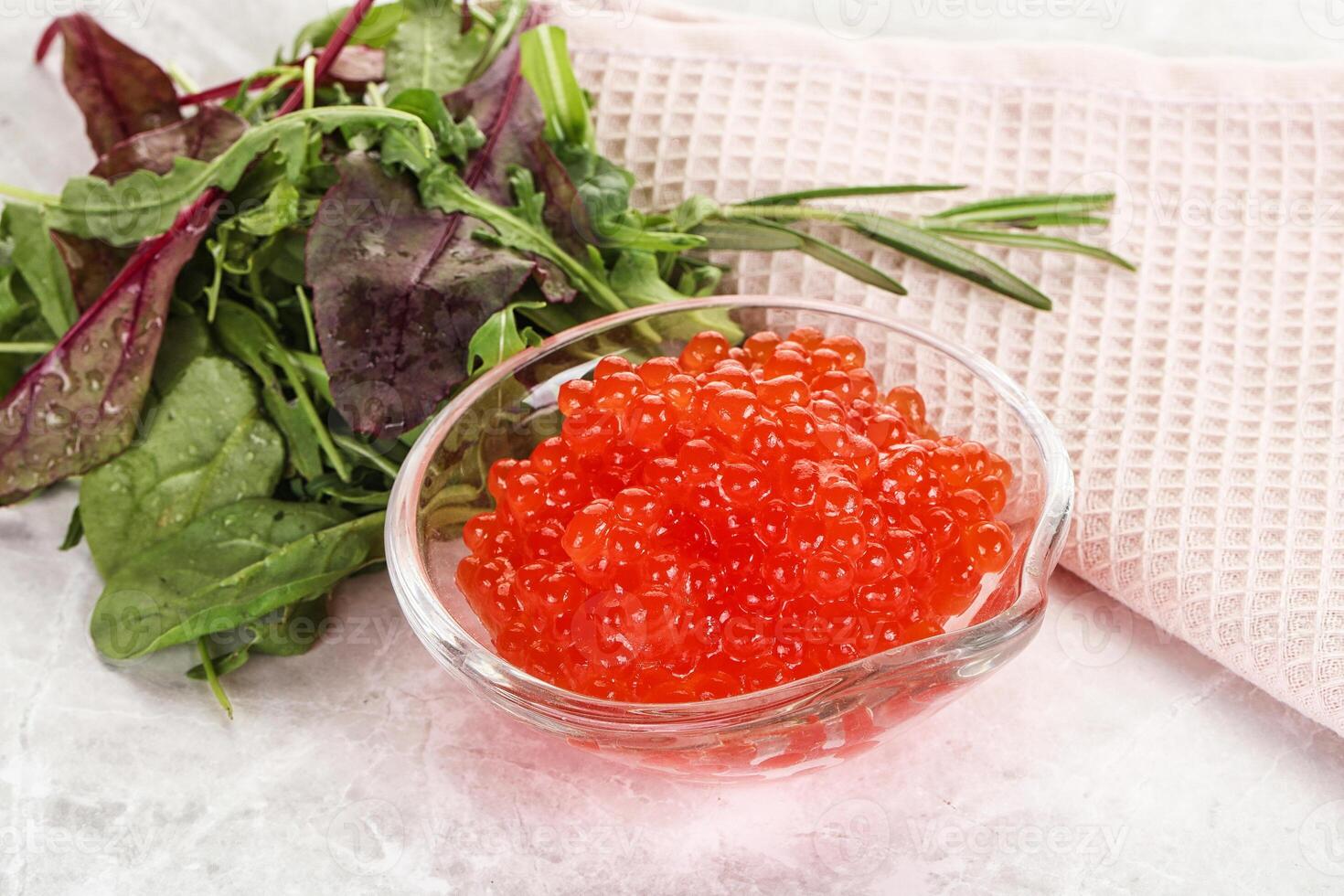 Red caviar in the bowl photo