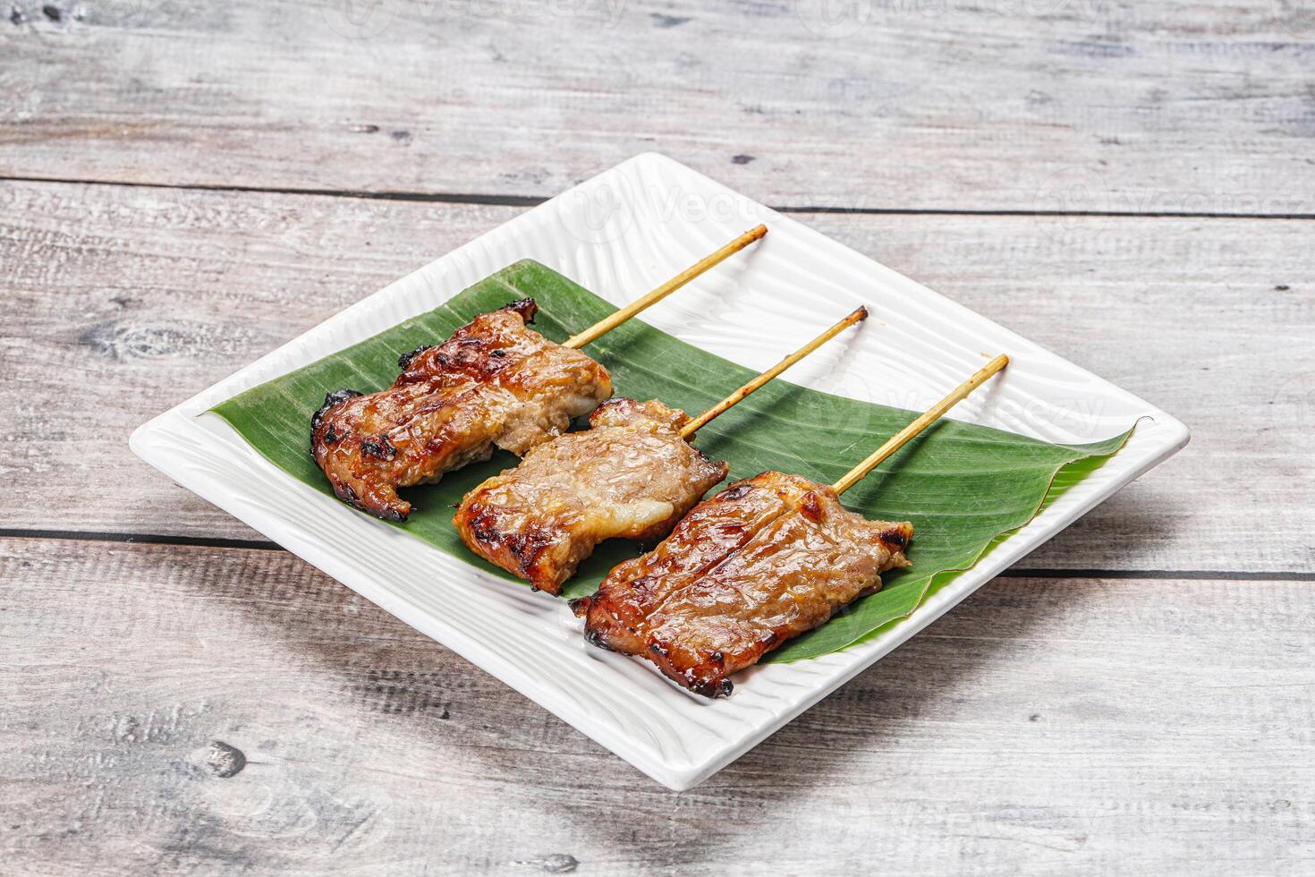 Thai cuisine - grilled pork skewer photo