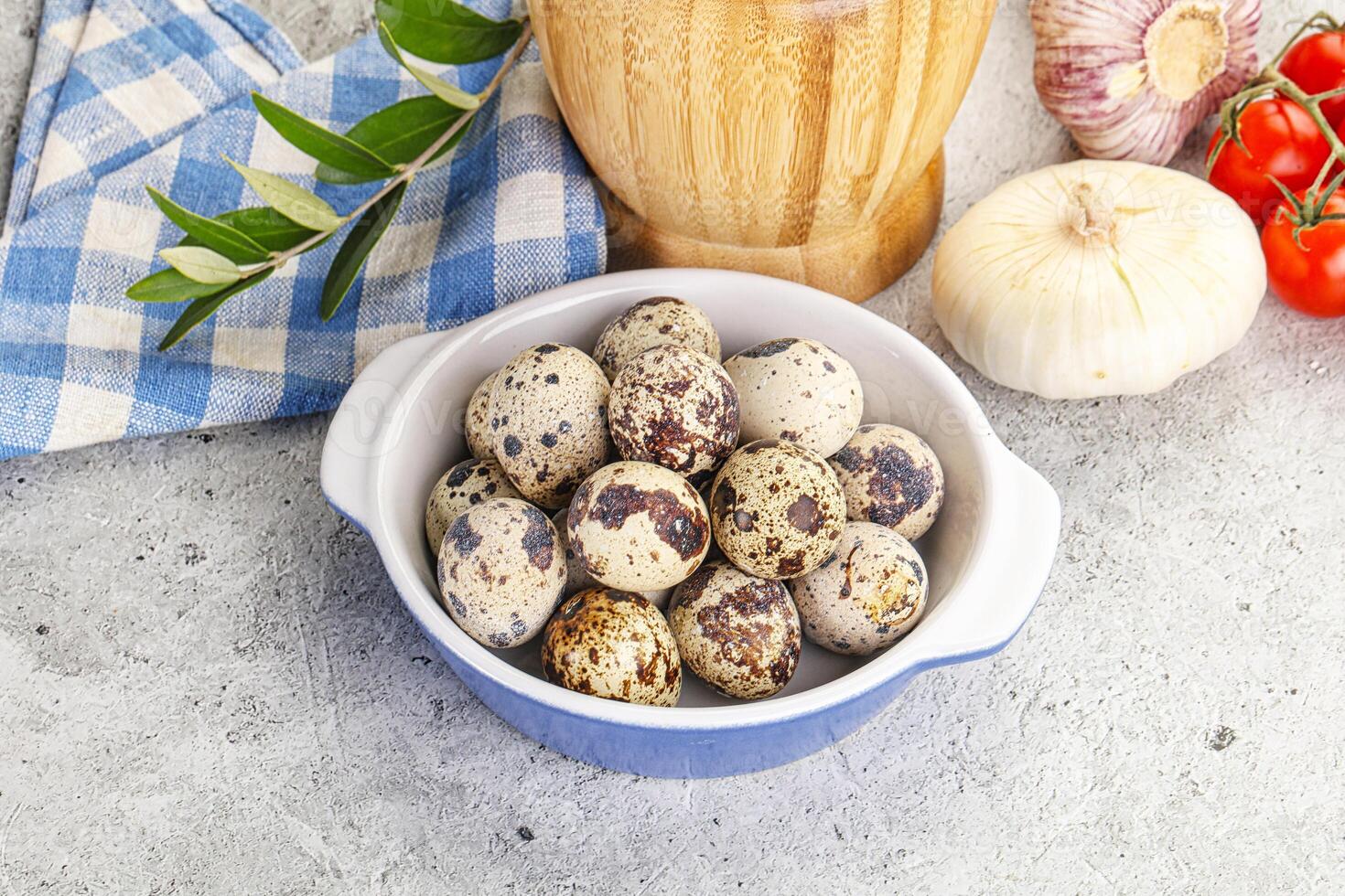 Raw quail eggs in the bowl photo