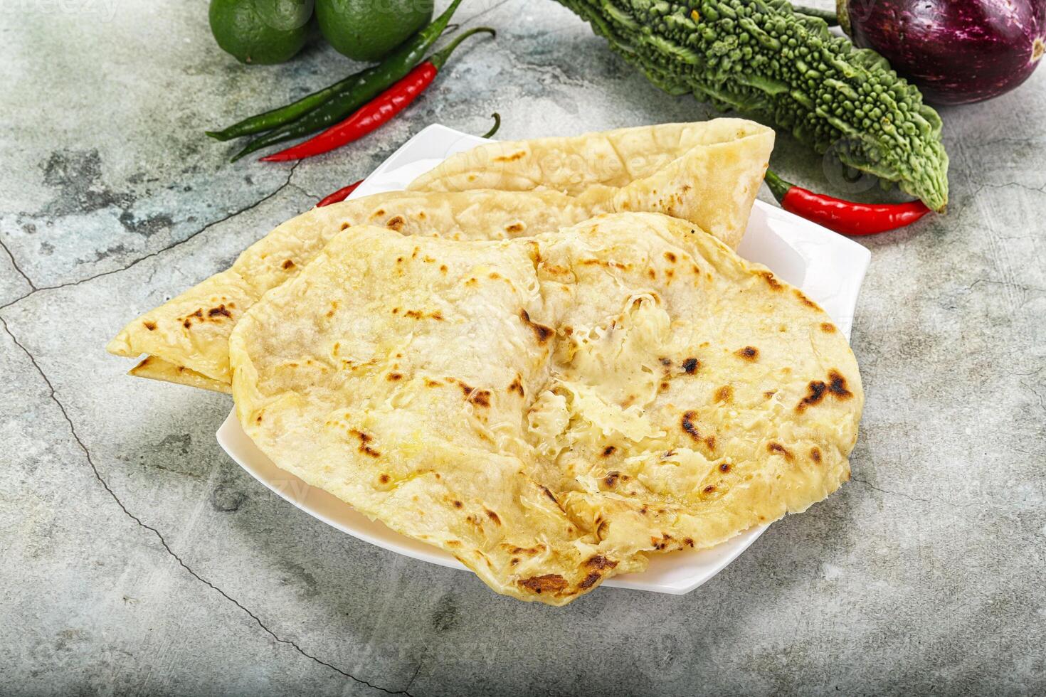 Indian tandori bread - naan with cheese photo