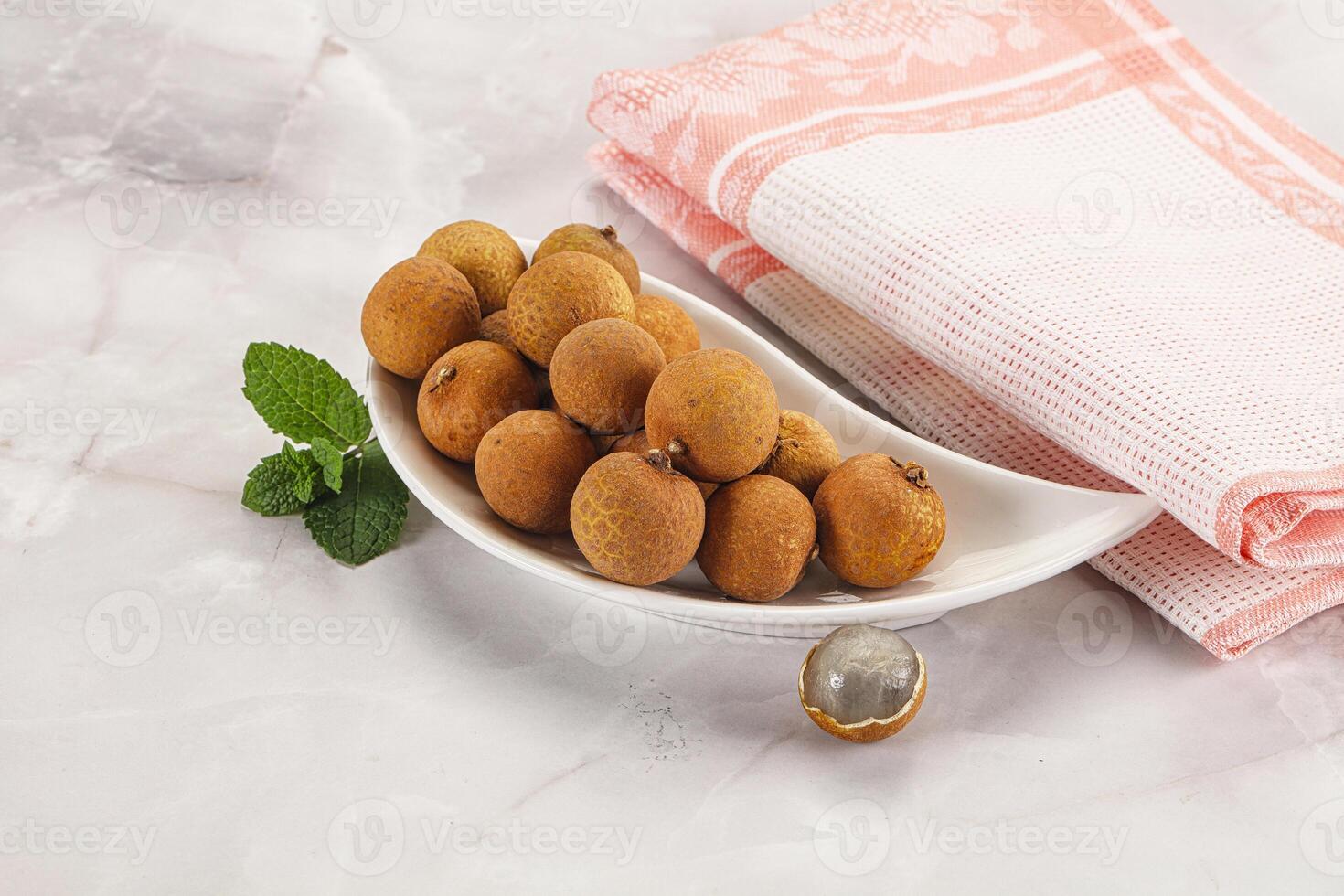 Tropical delicous fruit Longan heap photo