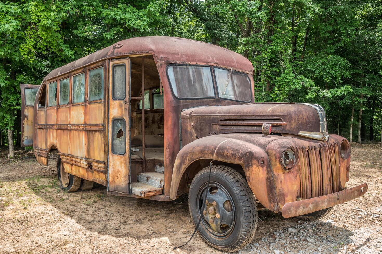 Rusty vintage school bus photo