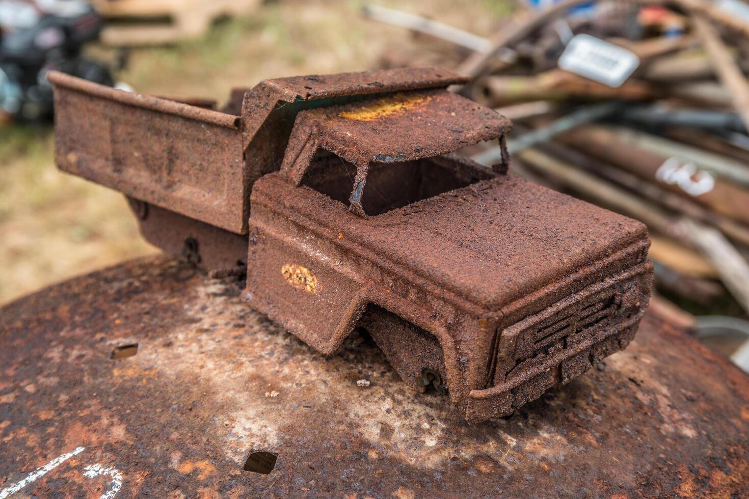 Rusted toy dump truck closeup photo