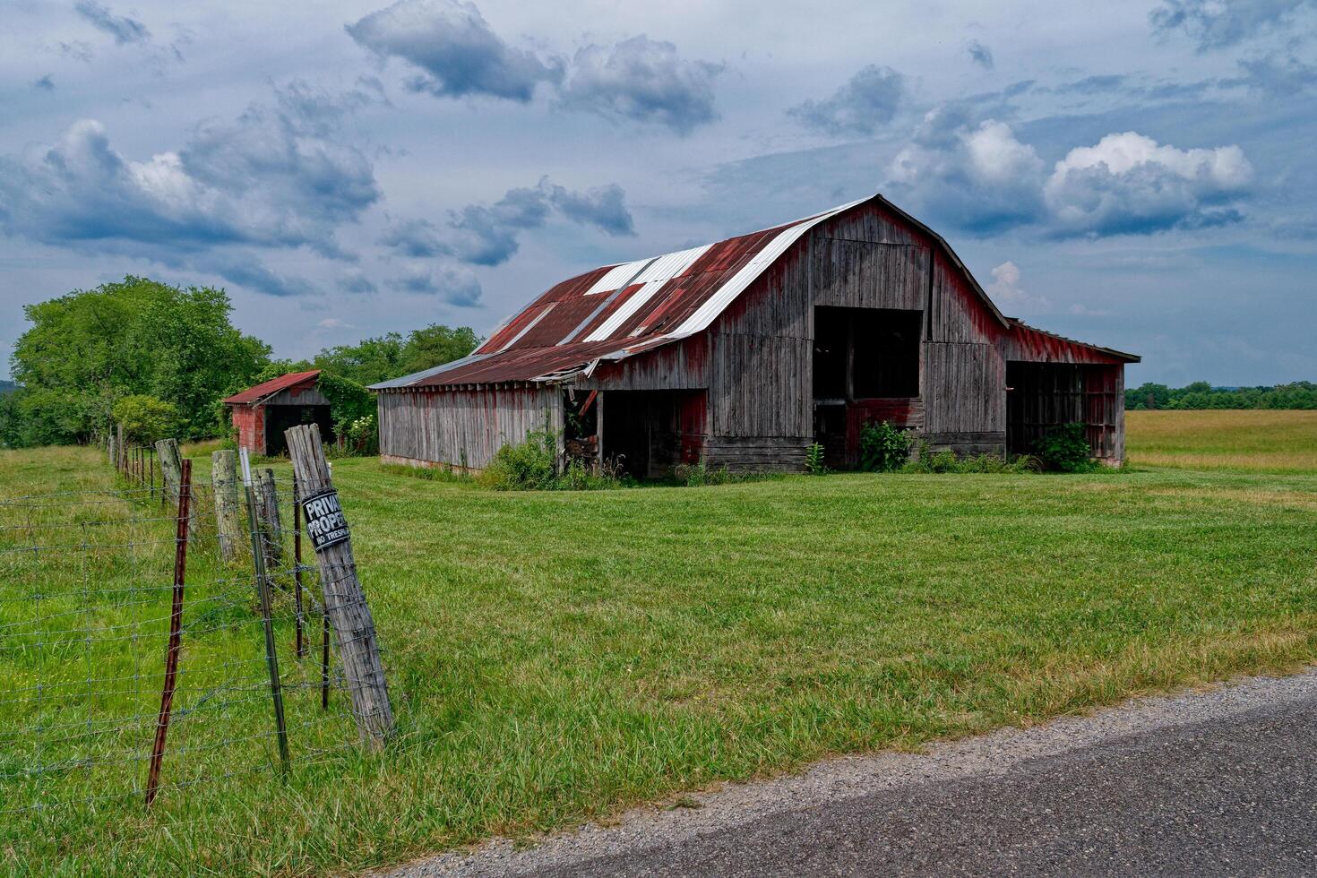 Old rustic barn on the farmland photo