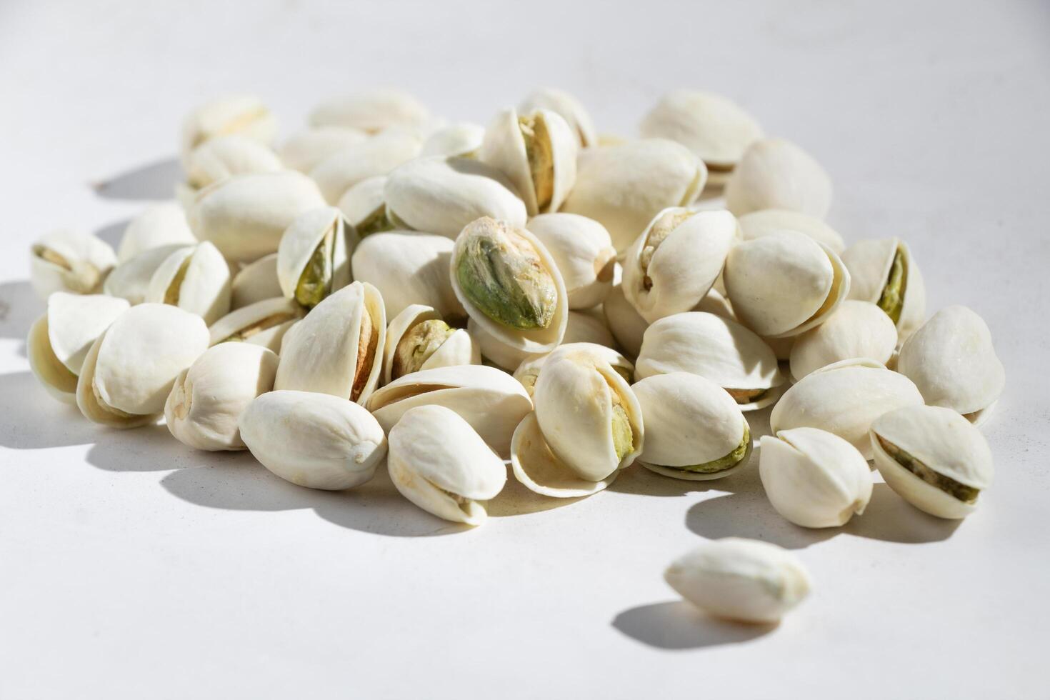 close up Seeds of pistachio nuts, chickpeas, peanuts isolated, white background photo