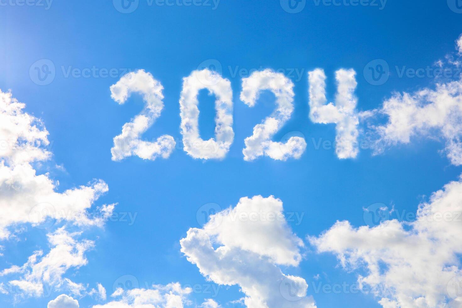 2024 year written on a blue sky of clouds. Concept of happy New year. photo