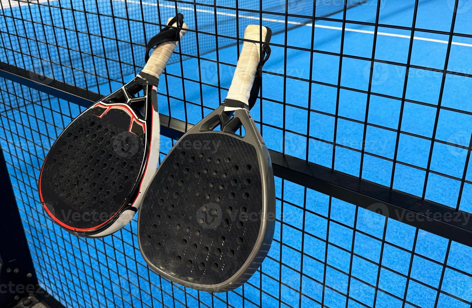 Padel tennis racket. Background with copy space. Sport court and balls. photo