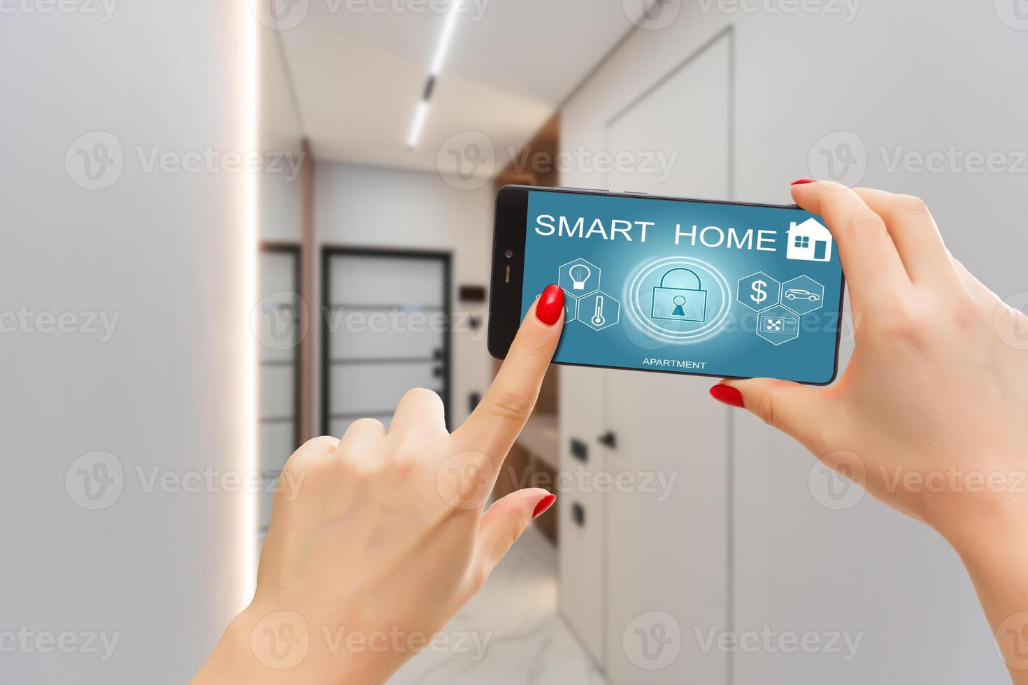 Smart home automation app on smartphone hold by female hand with home interior in background photo