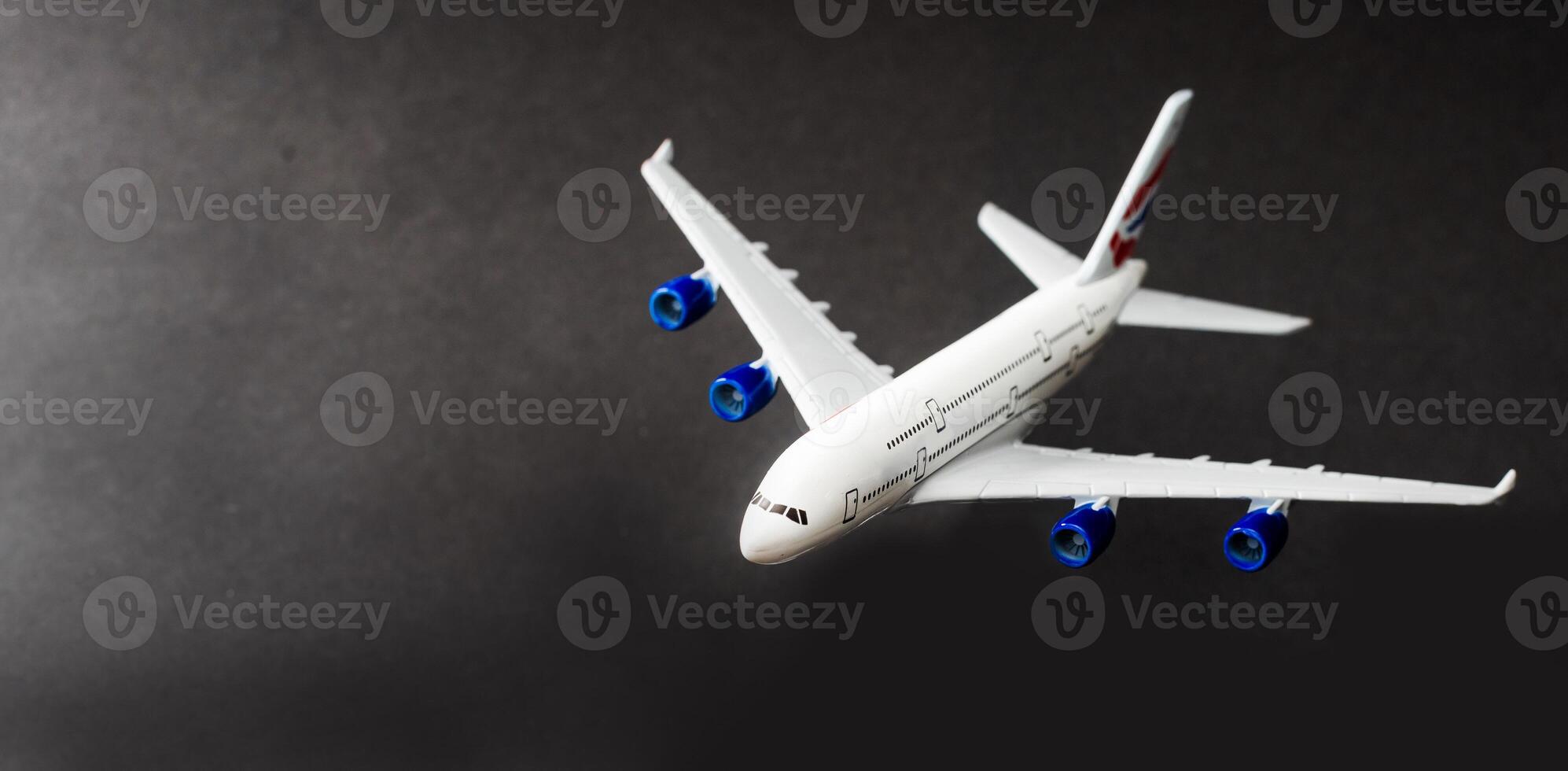 Model plane, airplane on dark background. photo