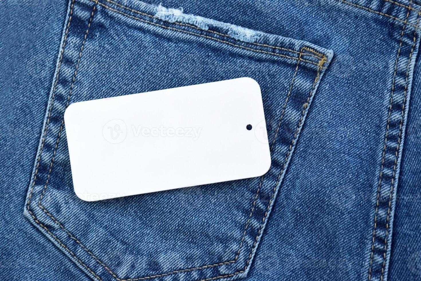 Blue jeans with white tag and LC Waikiki logo. photo