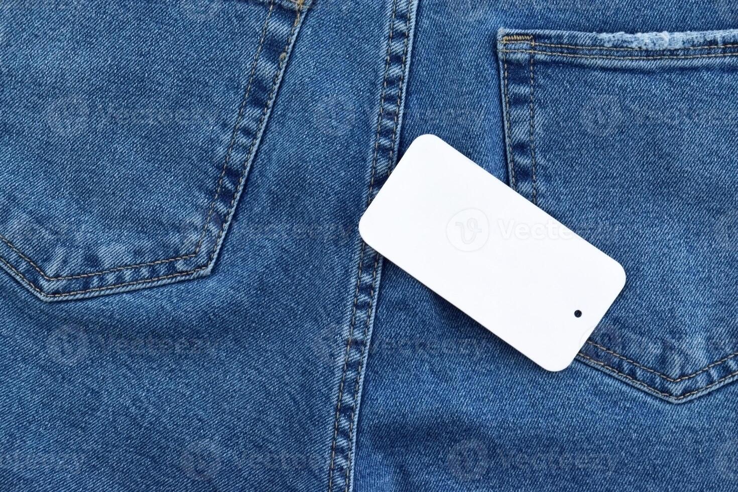 Blue jeans with white tag and LC Waikiki logo. photo