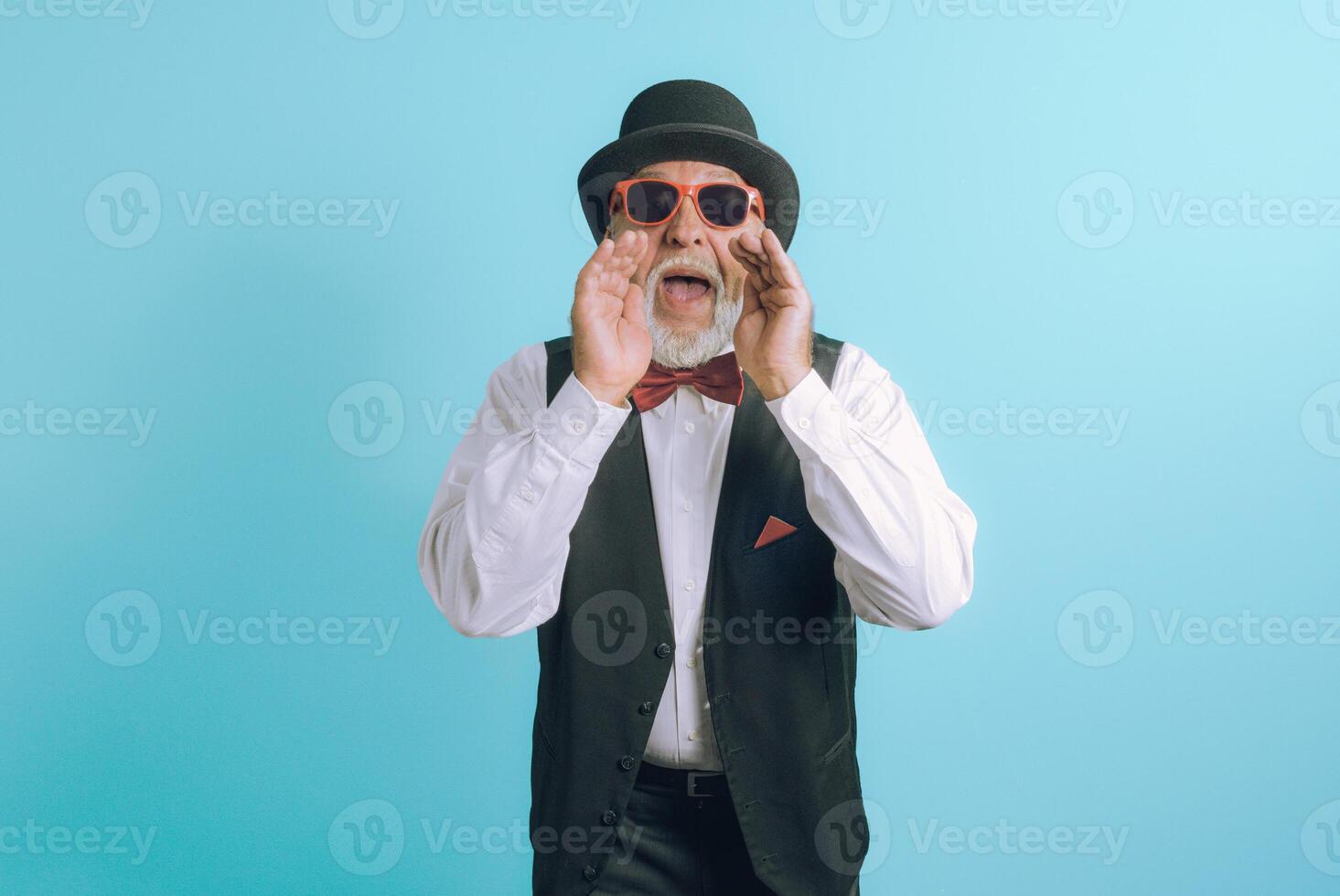 Invite to a party. imposing elderly man calls for an event. Light blue background. photo
