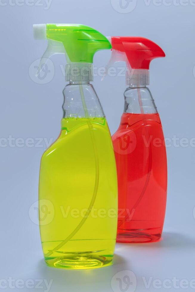 Two containers with detergent - red, green. on a white background photo