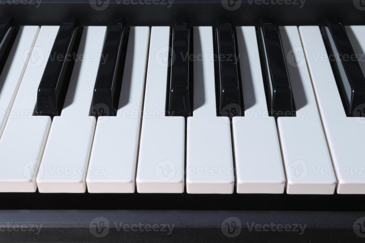 Piano keyboard close-up. View from the front photo
