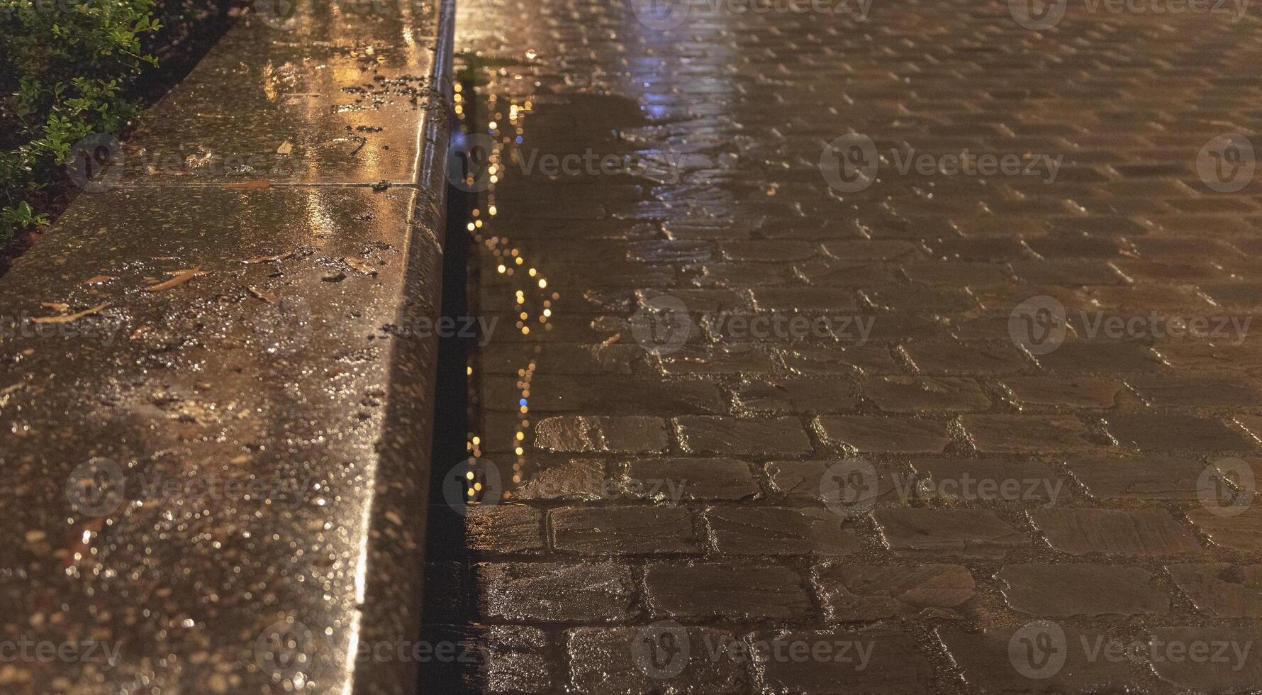 Texture of wet sidewalk after rain with illumination reflection photo