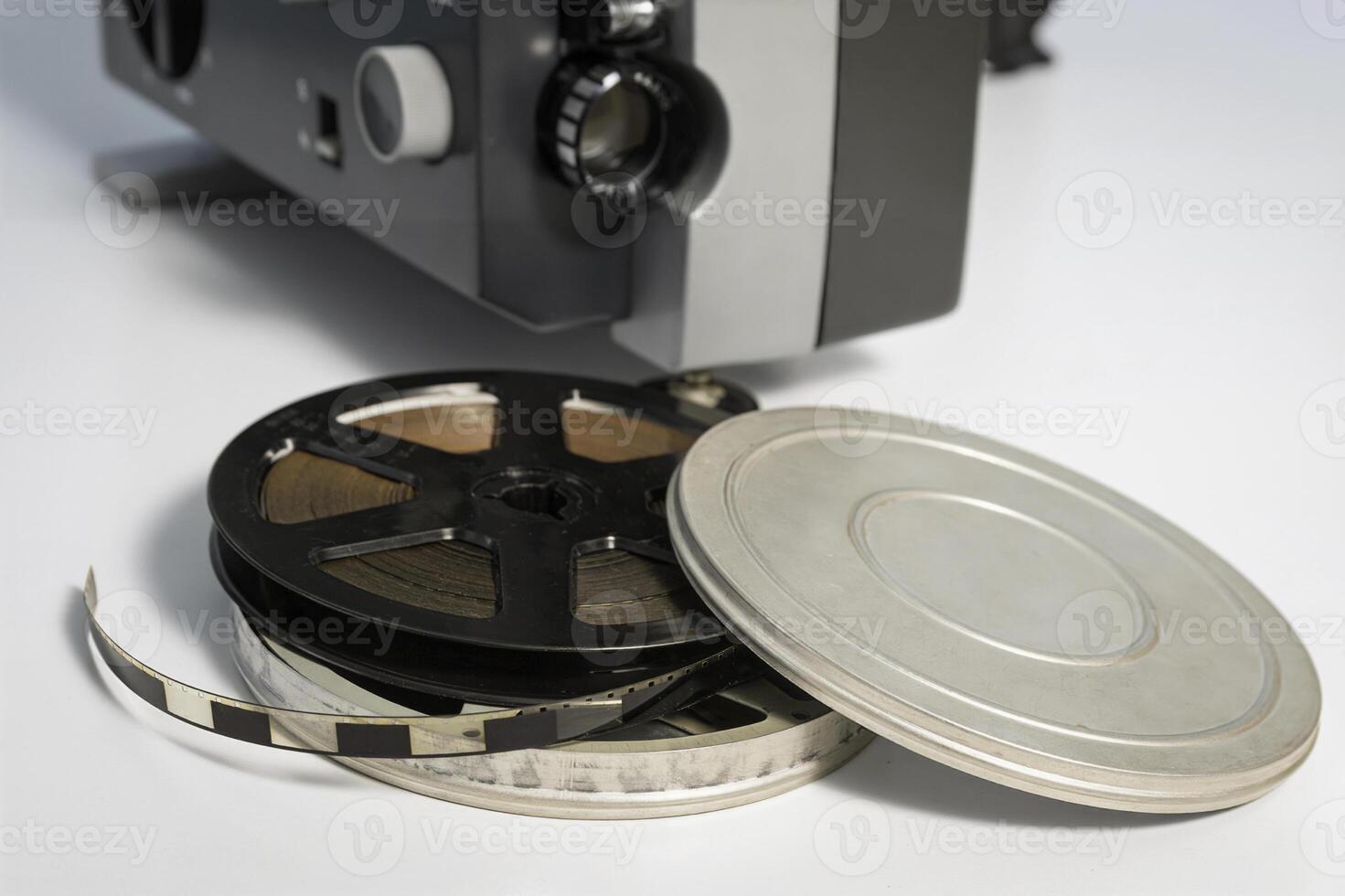 Authentic Reels with old 8mm films against the background of an old film projector. Close-up. Home movies from the 70s photo