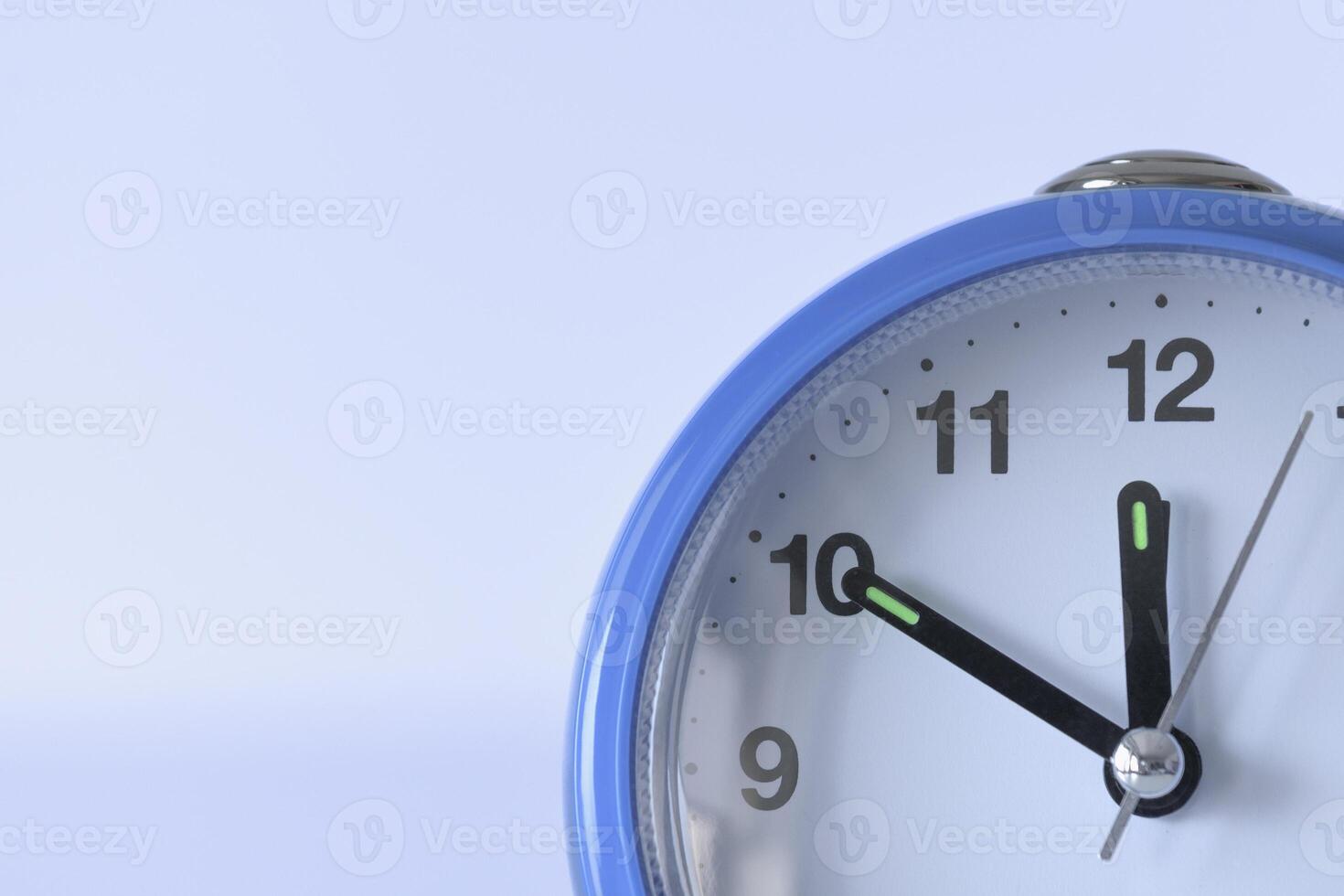 Alarm clock close-up. soft violet background. Time concept. Copyspace photo