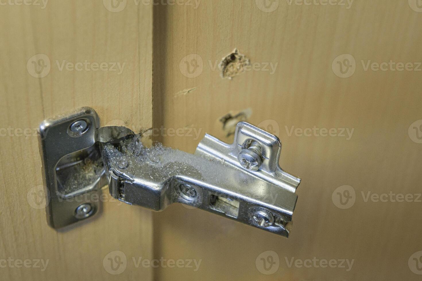 Broken furniture fittings in the linen closet. Close-up with details photo