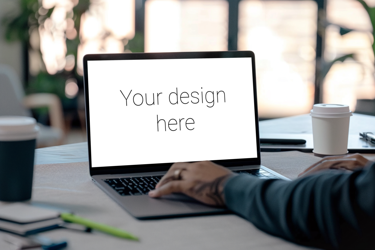Mockup of gray laptop on table. Man working with laptop. Back view psd