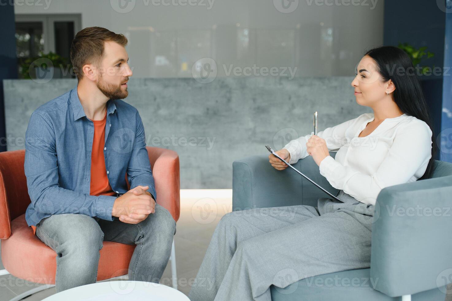 Upset man alcoholic sitting at psychologist on psychotherapy session, sad depressed addicted drunk guy alcohol addiction abuse, alcoholism concept. Social service, psychology patient photo
