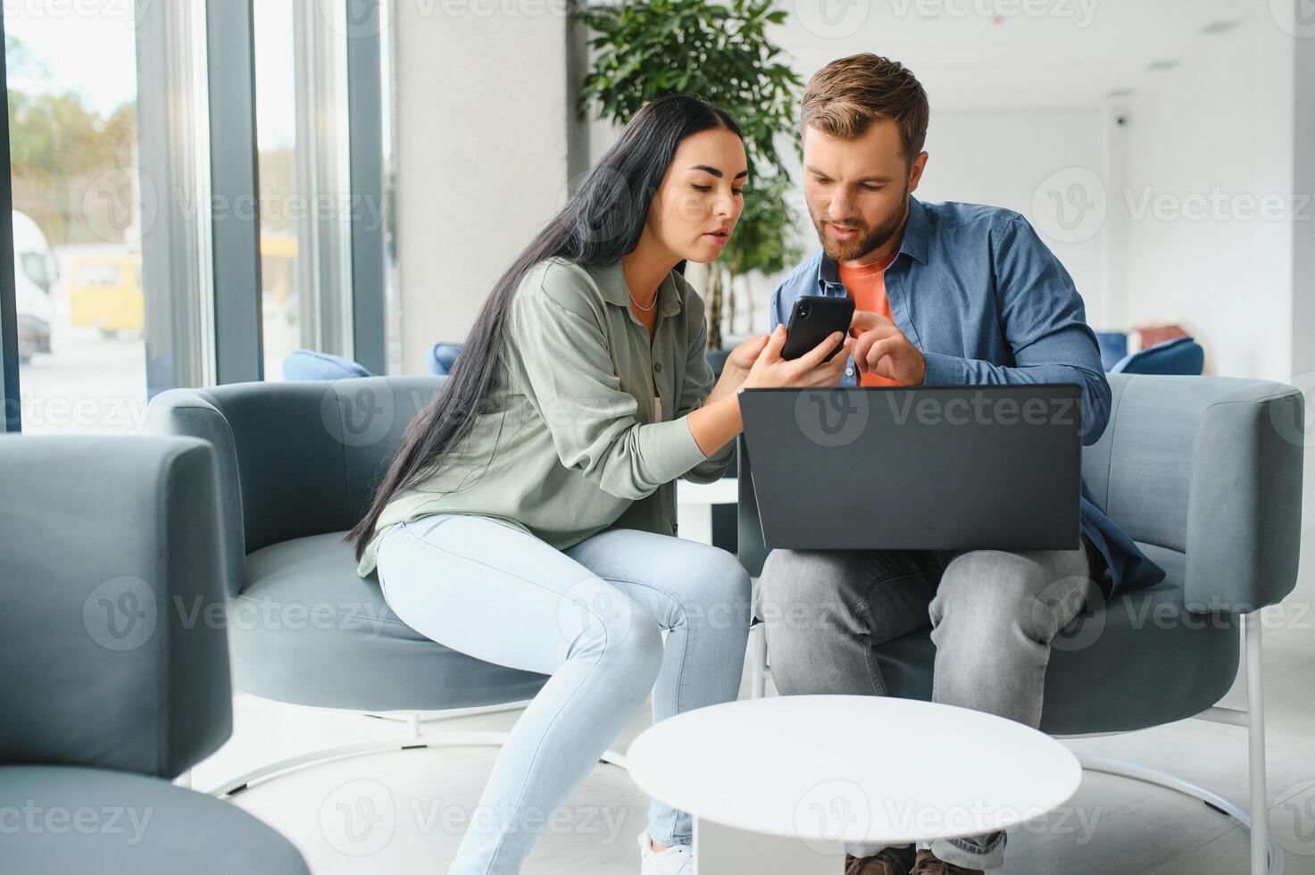 Business partners meeting in office lobby photo