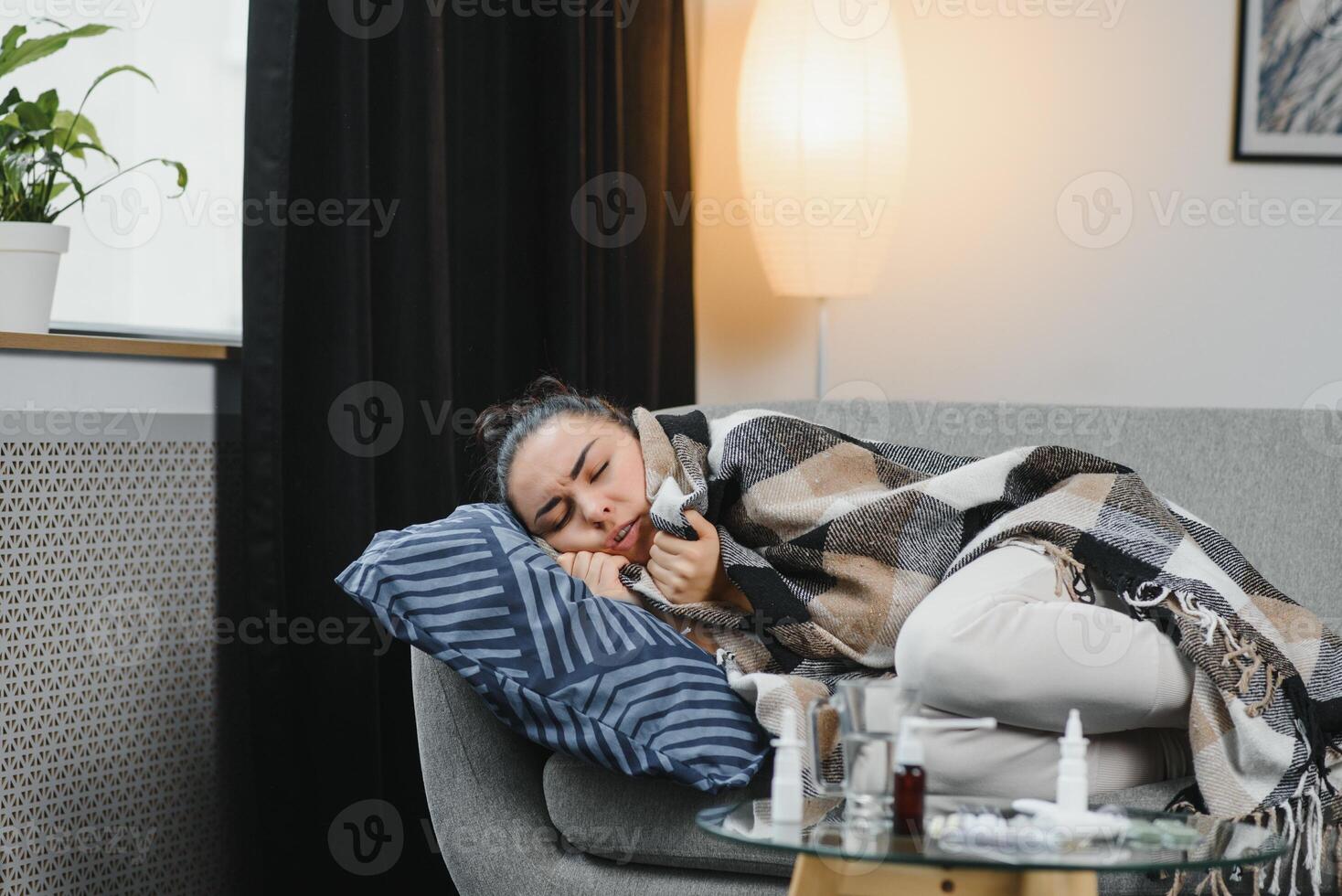 Young ill woman in bed at home. photo