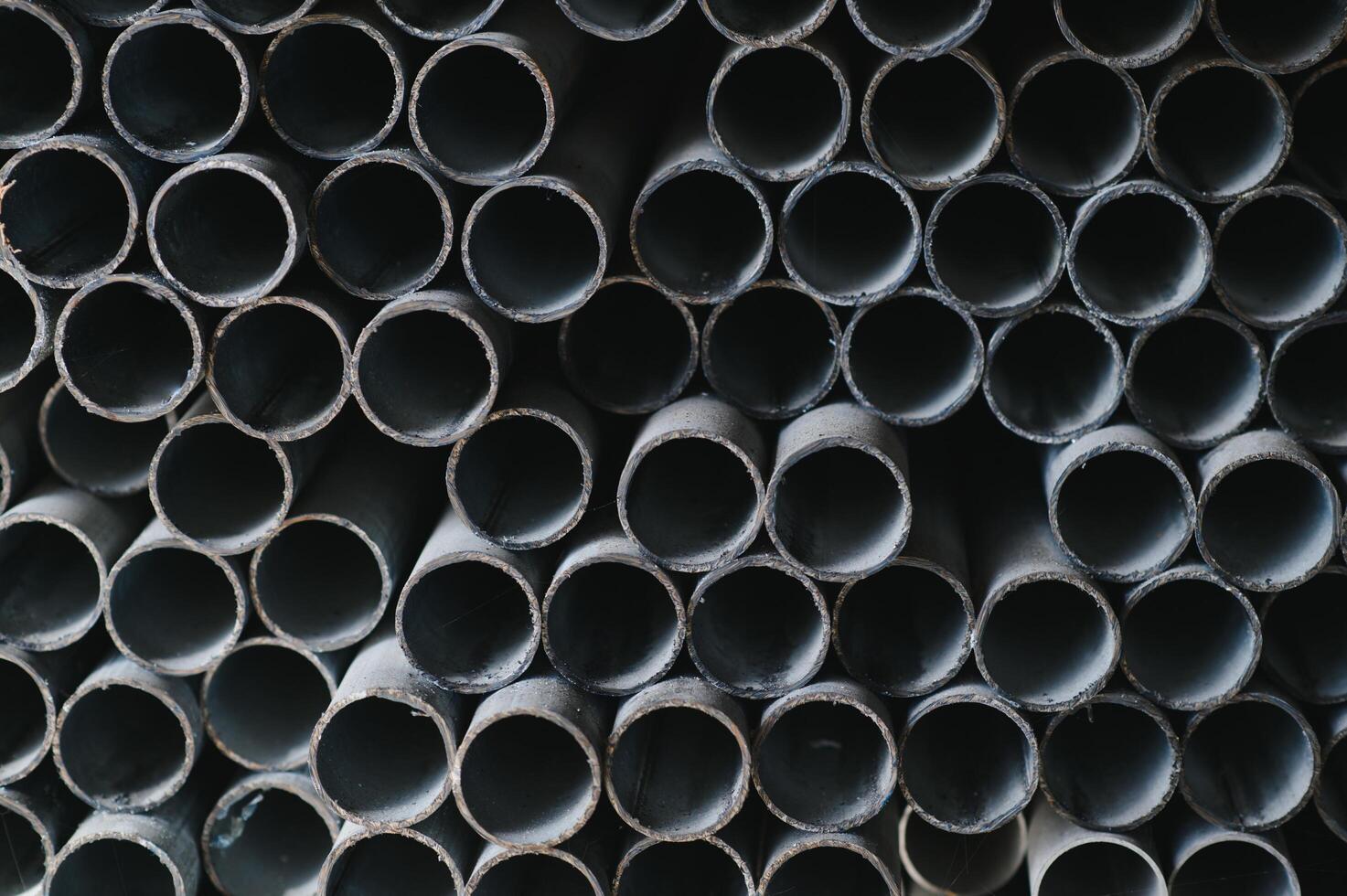 Stack of rolled metal products, perspective view of steel pipes of rectangular cross-section photo