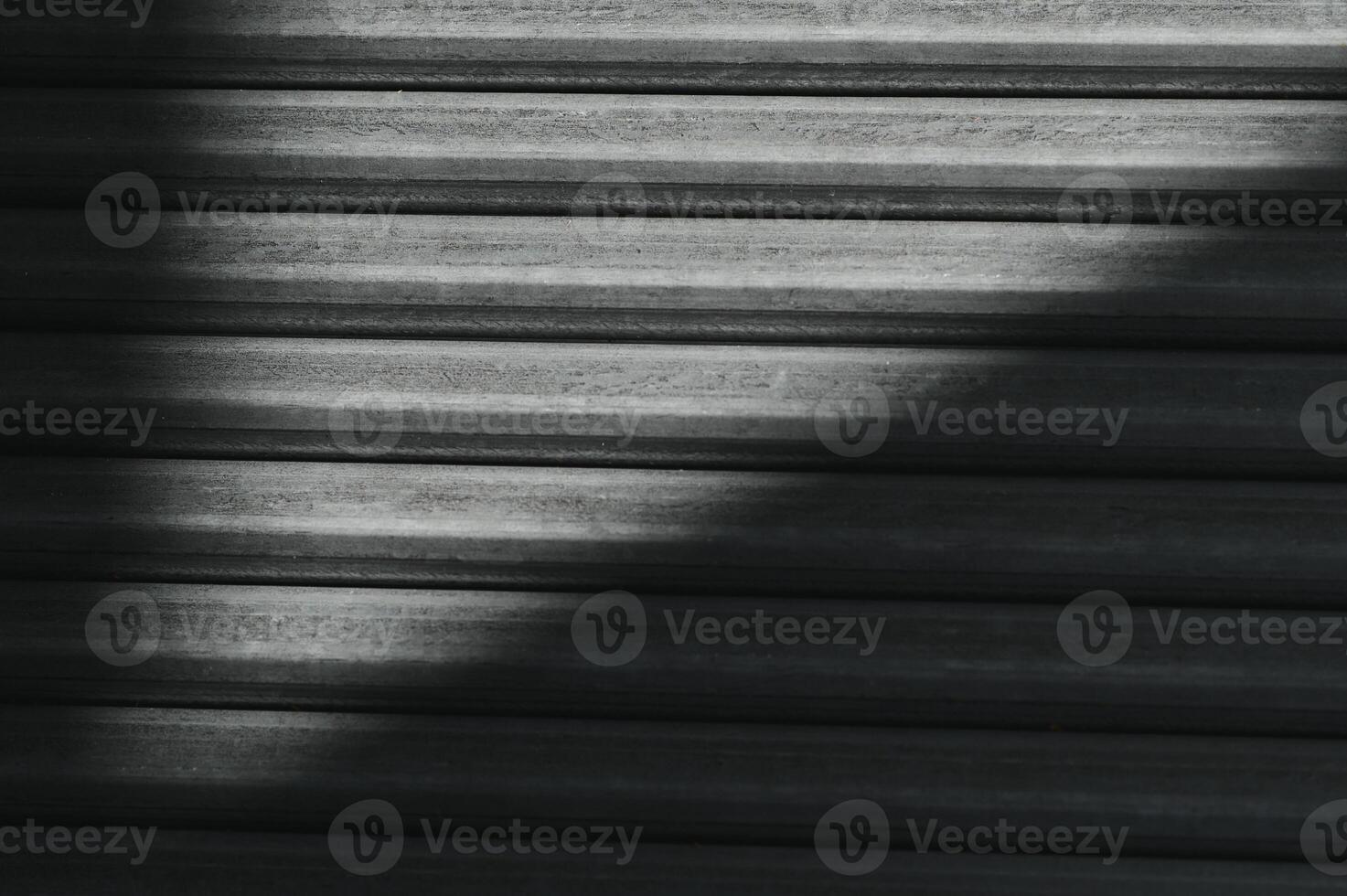 Stack of rolled metal products, perspective view of steel pipes of rectangular cross-section photo